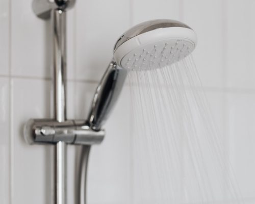 how to save on utility bills this winter - avoid long showers
