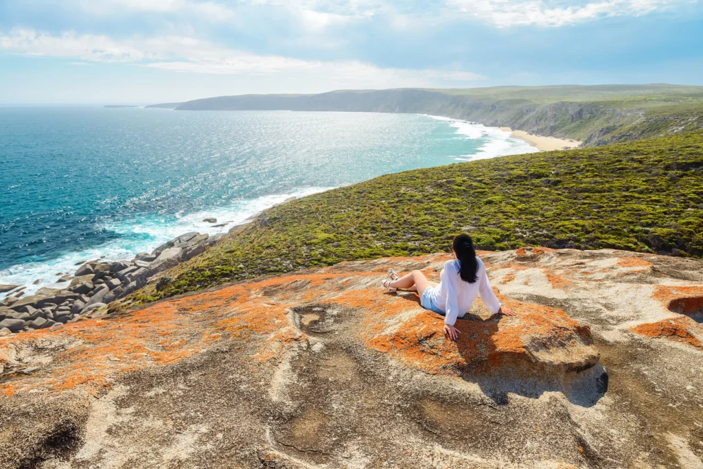 Woman looks out over the coastline of Kangaroo Island