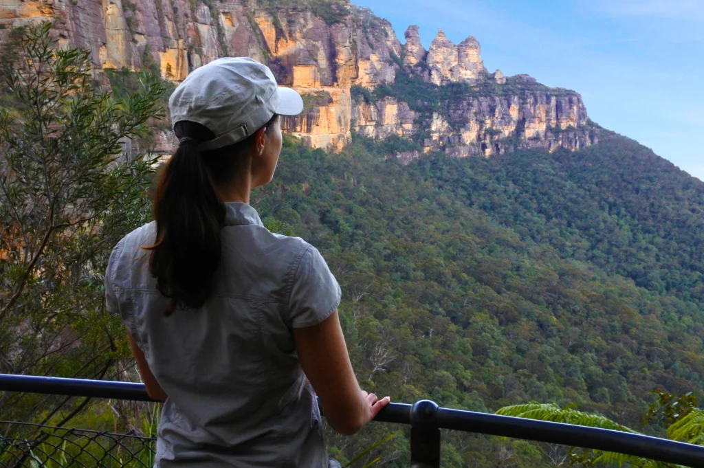 Woman looks at the Three Sisters in The Blue Mountains